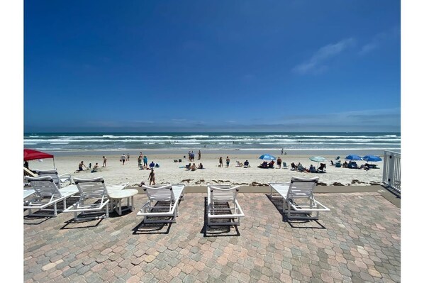 On the beach, sun-loungers, beach towels
