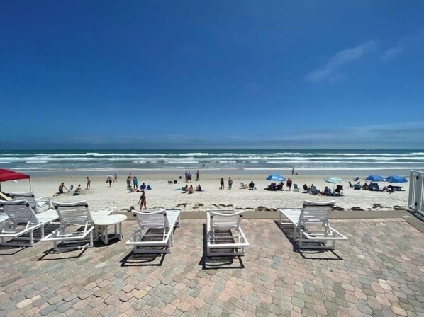On the beach, sun-loungers, beach towels