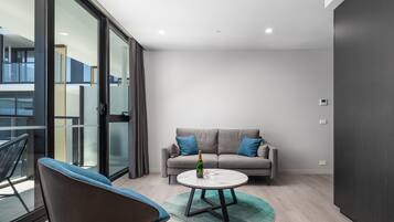 1 Bedroom Apartment | Living room | 50-inch Smart TV with digital channels, TV