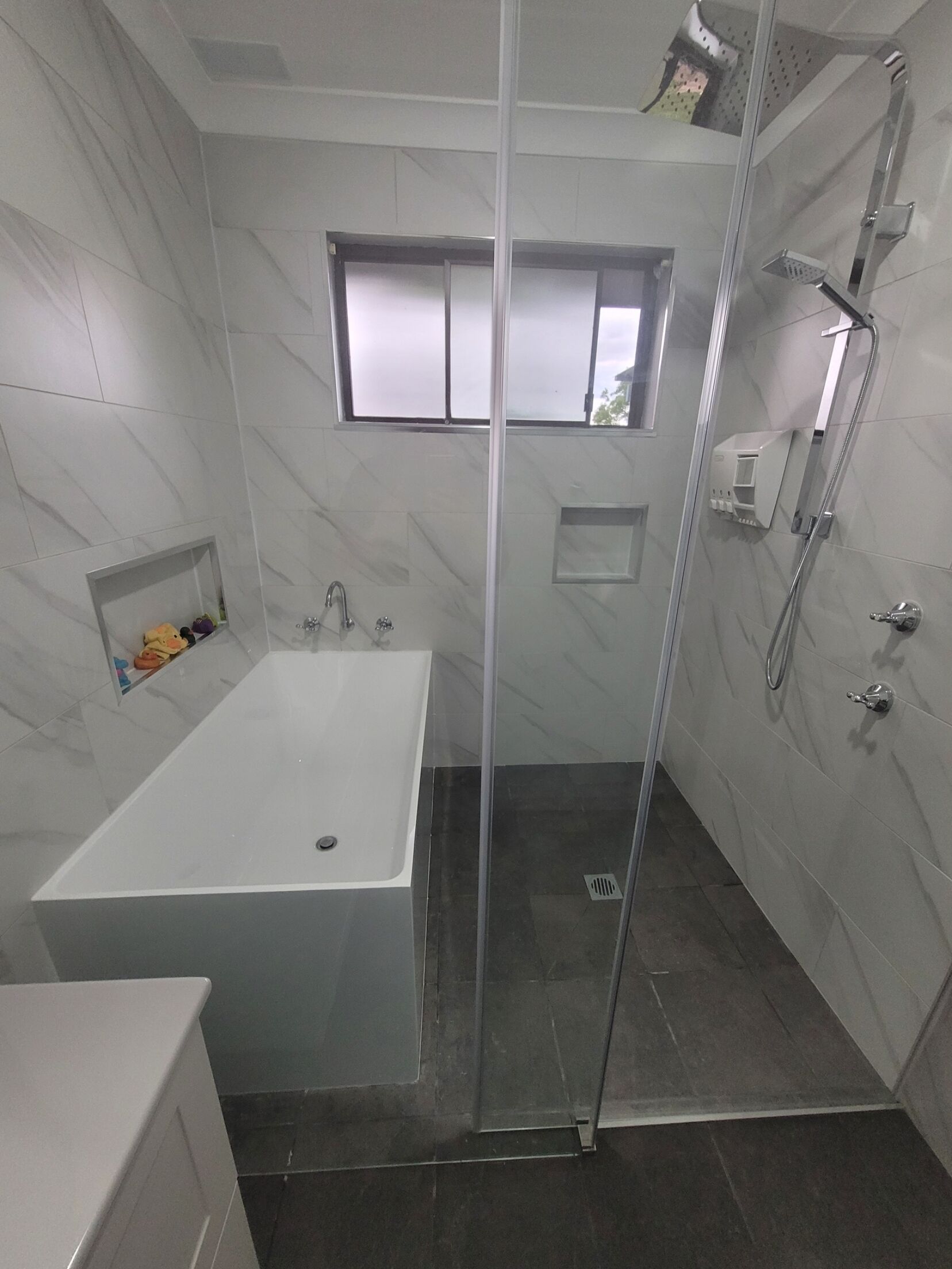 Bathtub, hair dryer, towels, soap