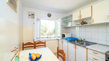 Apartment (Three-Bedroom Apartment) | Private kitchen | Fridge
