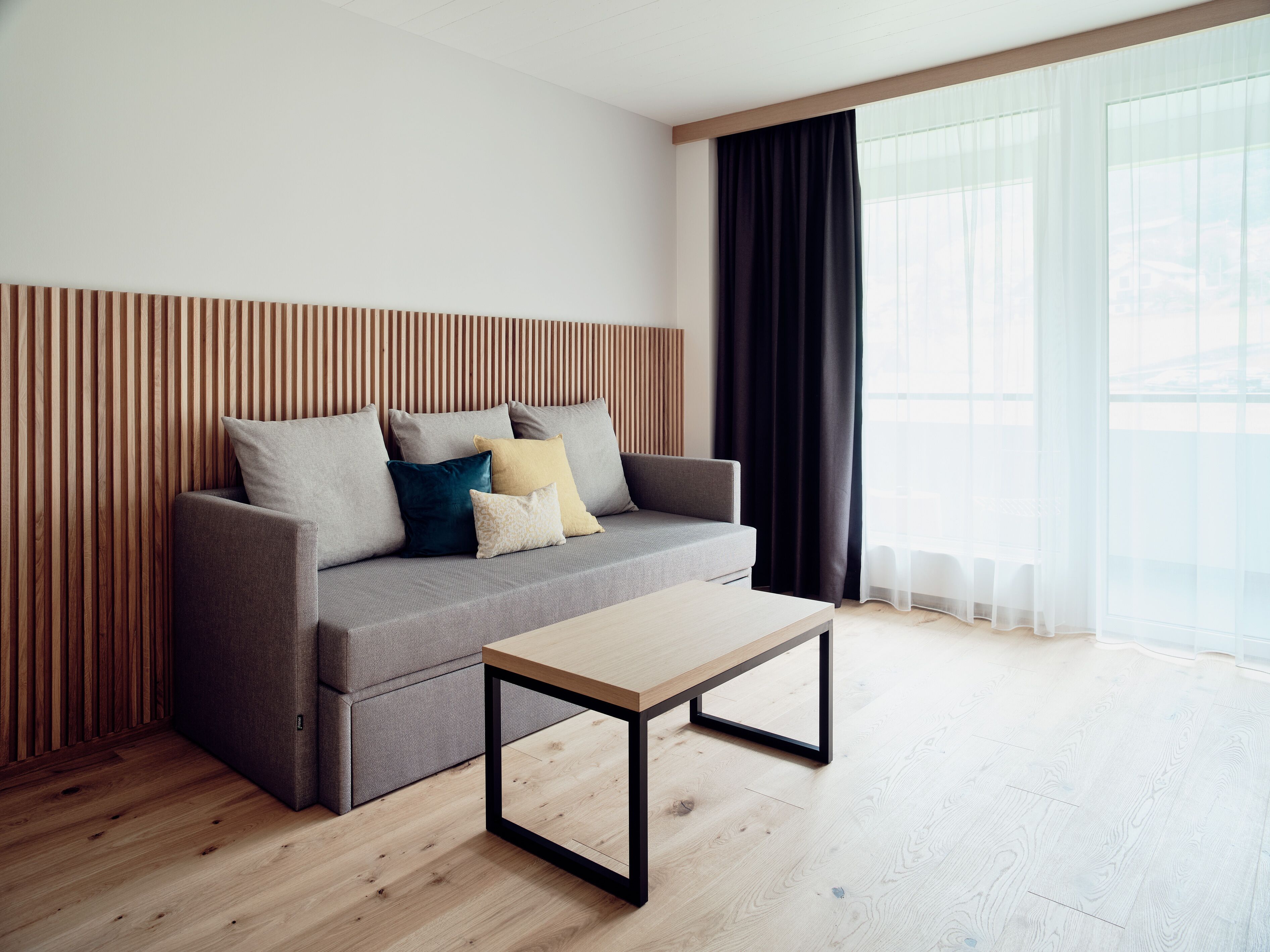 grand studio suite | living area | flat-screen tv