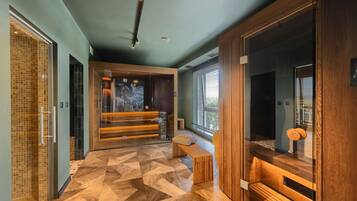 A modern interior with a geometric patterned floor, wooden benches, and a glass partition.