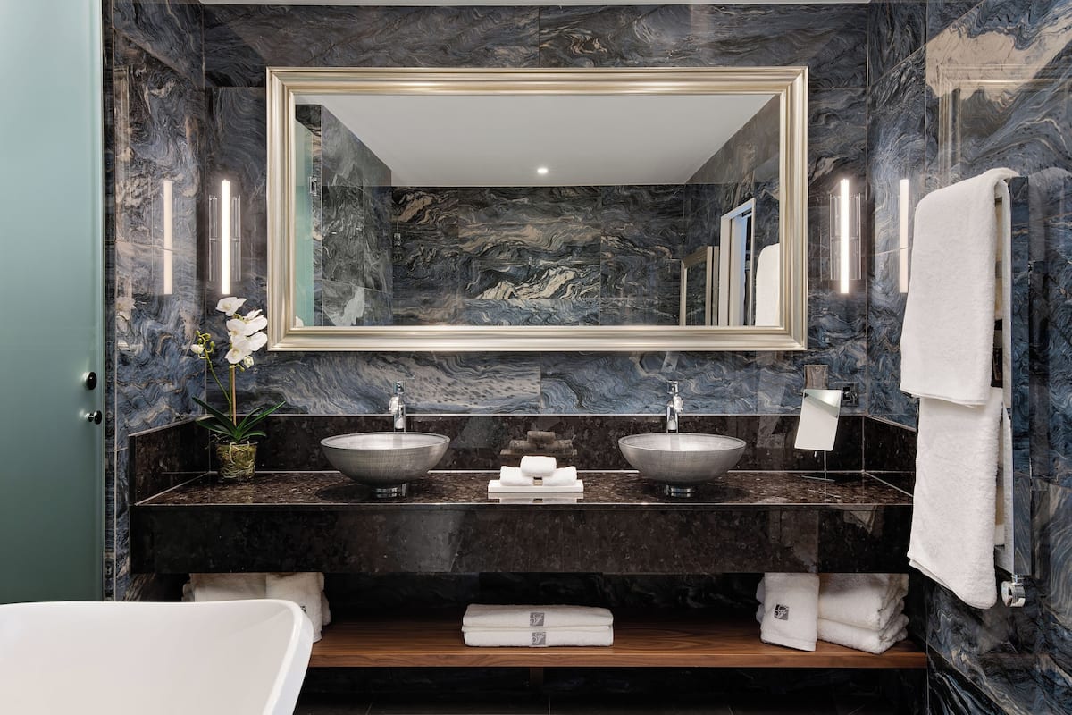 signature suite, 1 bedroom, balcony | bathroom | bathrobes, slippers, towels