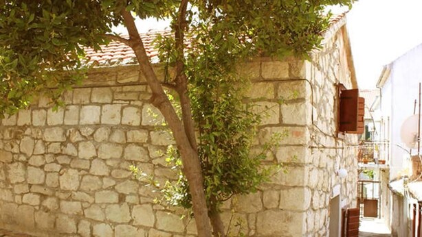 A narrow stone building with a tree in front. - Dalmatian Cottage, Pedestrian Zone (Split)