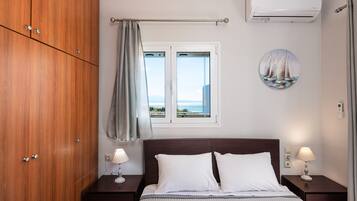 Apartment, 3 Bedrooms, Sea View | 3 bedrooms, in-room safe, soundproofing, iron/ironing board