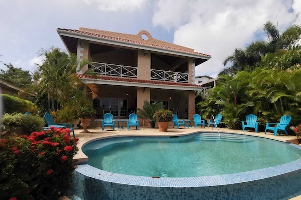 Pride of Courland Tobago Front View with Infinity Edge Salt WaterPool