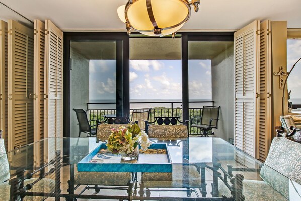 Enjoy dining in style with a spacious table and comfortable seating for two.