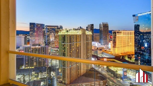 A cityscape view from a high-rise building at dusk.