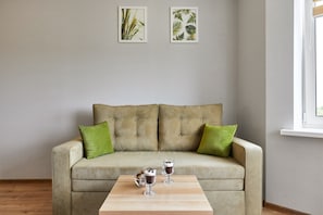 Comfort Apartment | Living area | 40-inch flat-screen TV with digital channels, TV - PaulMarie Apartments on Mayakovskogo (Minsk)