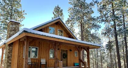 Nestled-in-pines, sooth-your-soul custom home with an incredible mountain view.