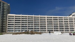 A large, multi-story hotel with a uniform exterior and balconies.