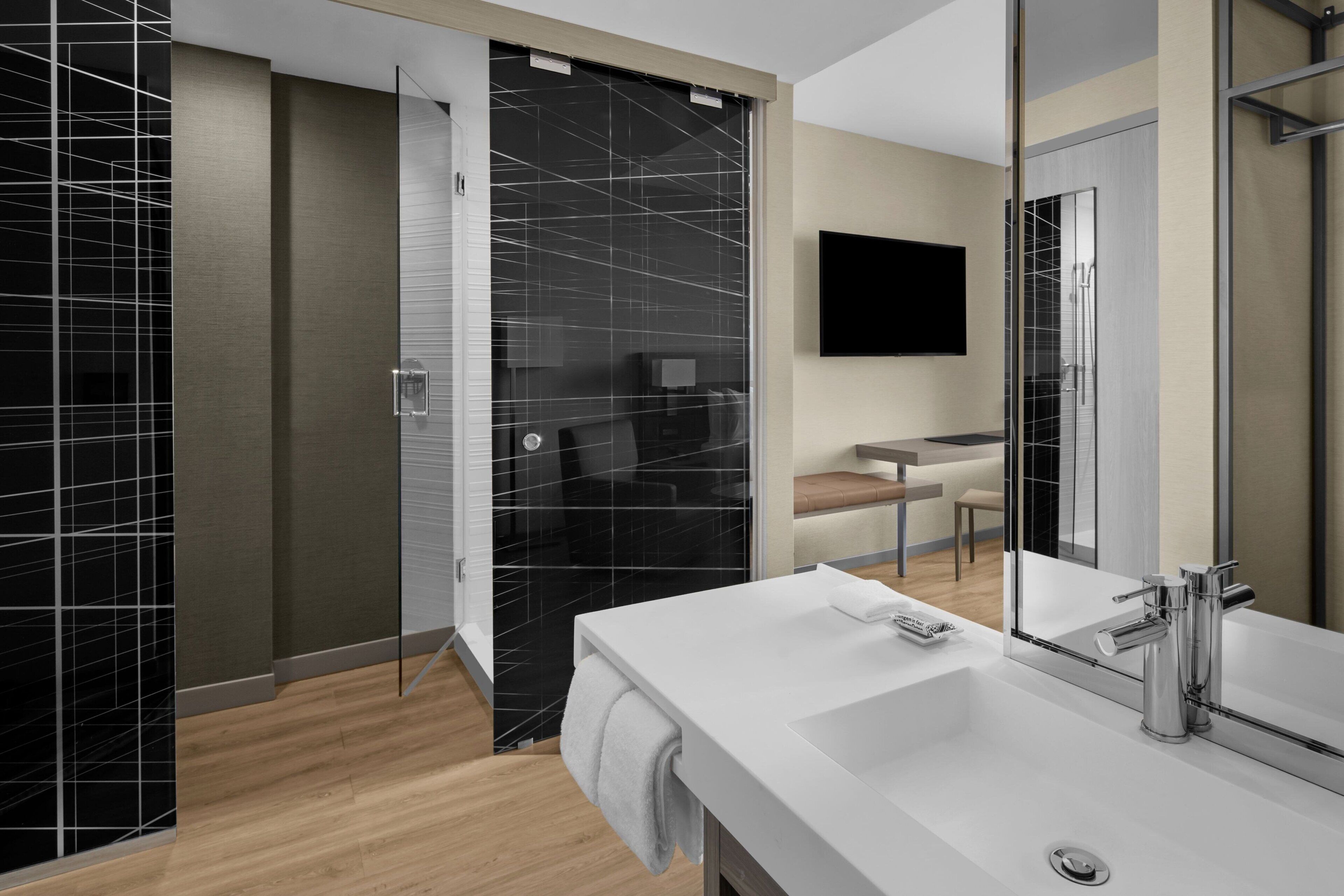 designer toiletries, hair dryer, towels, soap