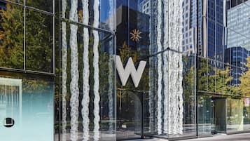 A modern building with a glass facade and a prominent 'W' logo.