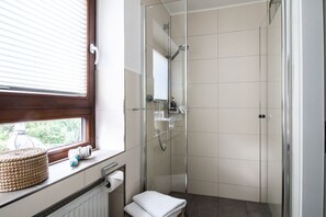 Shower, hair dryer, towels, soap