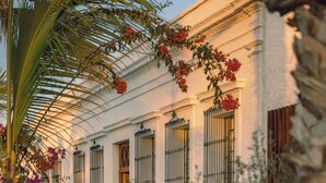 A building with a classical facade, large windows, and a covered entrance. - Baja Club Hotel, La Paz, Baja California Sur, a Member of Design Hotels (La Paz)