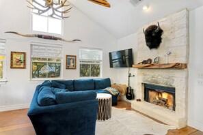 TV, fireplace, books