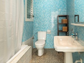 Bathtub, hair dryer, towels