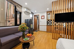 Deluxe Studio | Living area | Smart TV, fireplace - 22Housing 39 Linh Lang (Hanoi)