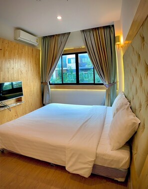 Deluxe Premier Room | Escrivaninha, cortinas blackout, Wi-Fi de cortesia, roupa de cama