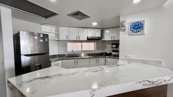 Fridge, microwave, stovetop, coffee/tea maker