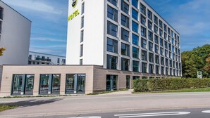 A modern hotel building with a prominent 'HOTEL' sign on the facade. - B&B Hotel Neu-Ulm (Neu-Ulm)