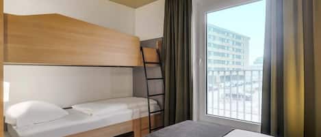 Ropa de cama hipoalergénica, escritorio y sistema de insonorización