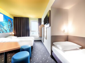 A hotel room with two beds, a desk, and a chair. - B&B Hotel Rust-Ettenheim (Mahlberg)