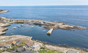 Watch the boats go by in Pigeon Cove.