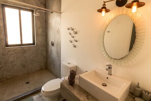 Shower, towels, soap, toilet paper