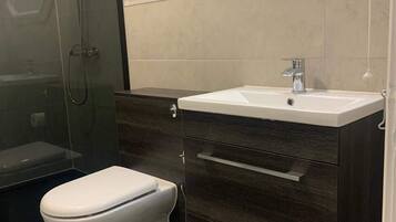 Shower, hair dryer, towels, shampoo