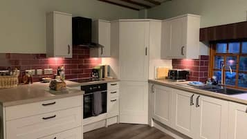 Coffee/tea maker, fridge, microwave, oven