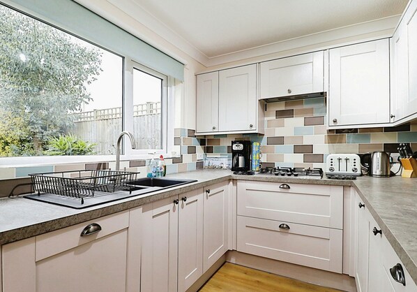 Cottage | Private kitchen | Oven, stovetop, highchair, cookware/dishes/utensils