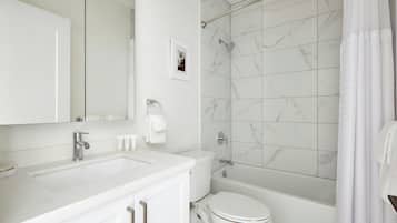 Designer toiletries, hair dryer, towels