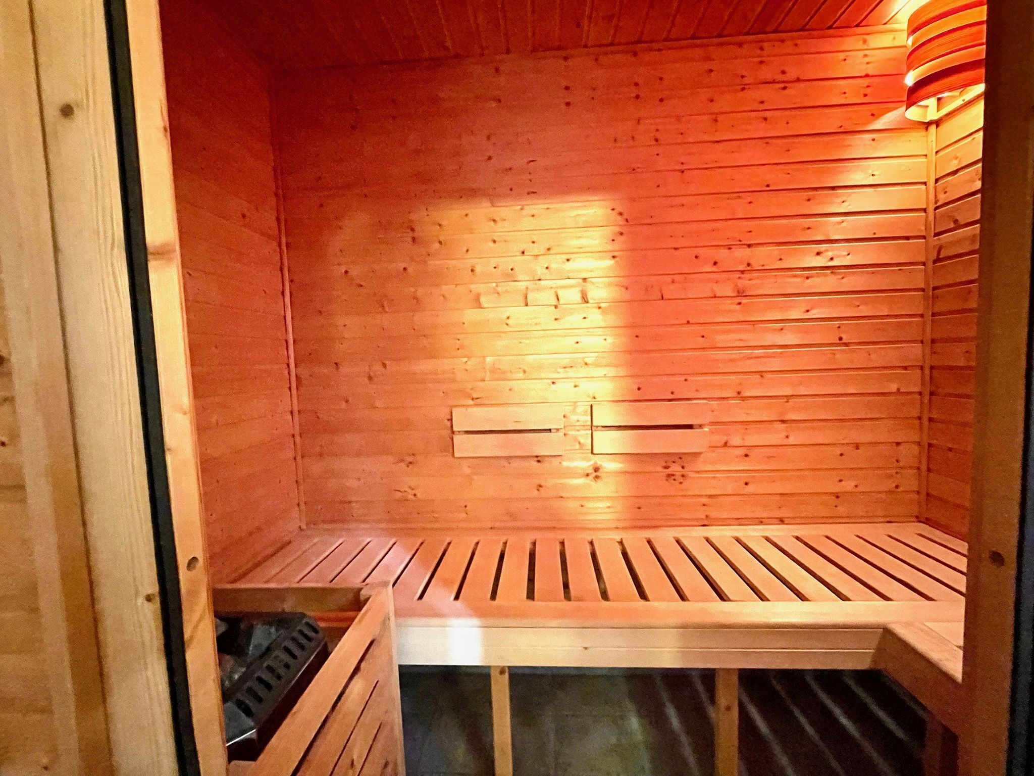 A sauna with wooden walls and benches.