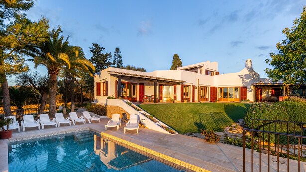 A modern house with a swimming pool, lounge chairs, and a well-maintained lawn. - Villa Bon Viure with Sea View, Wi-Fi, Air Conditioning, Pool, Garden & Terraces; Parking Available (Marratxí)