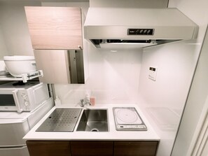 Fridge, microwave, cookware/dishes/utensils