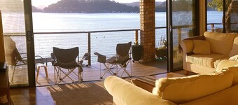 Waterfront! Stunning boat access only home. Deep water jetty. Sunset views