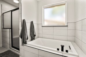 Bathtub, jetted tub, hair dryer, towels