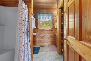 Bathtub, towels, toilet paper
