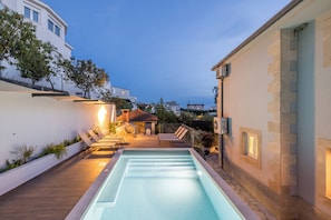 Seasonal outdoor pool, pool umbrellas, pool loungers
