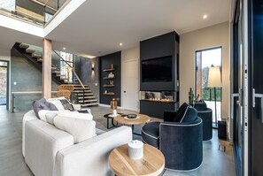 TV, fireplace, table football, stereo - Ohana Chalet | Luxurious Property | Hot tub / Tremblant Living (La Conception)