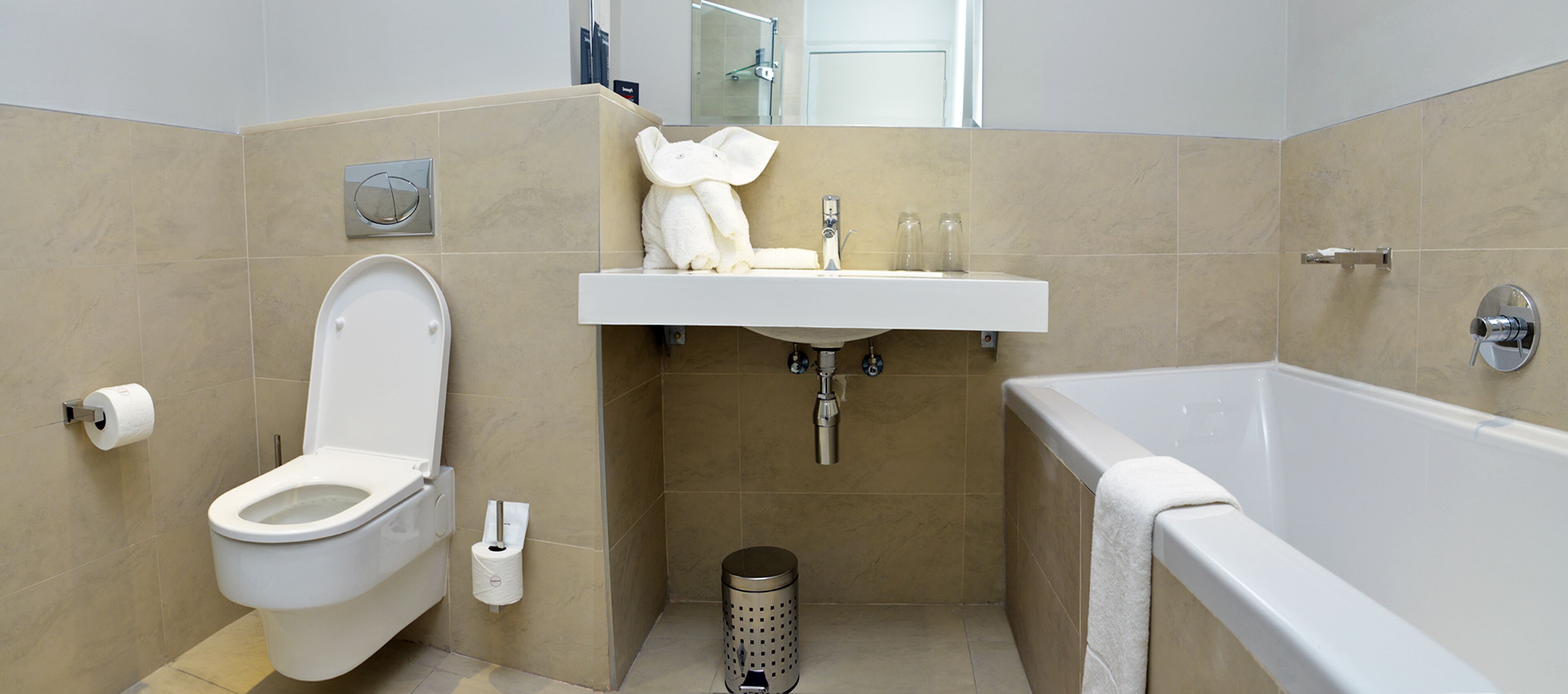 standard twin room | bathroom | separate bathtub and shower, hair dryer, towels, soap