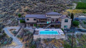 A two-story house with a swimming pool, a covered patio, and a view of the surrounding hills. - WATER FRONT - PRIVATE POOL AND DOCK W/BUOY (Manson)