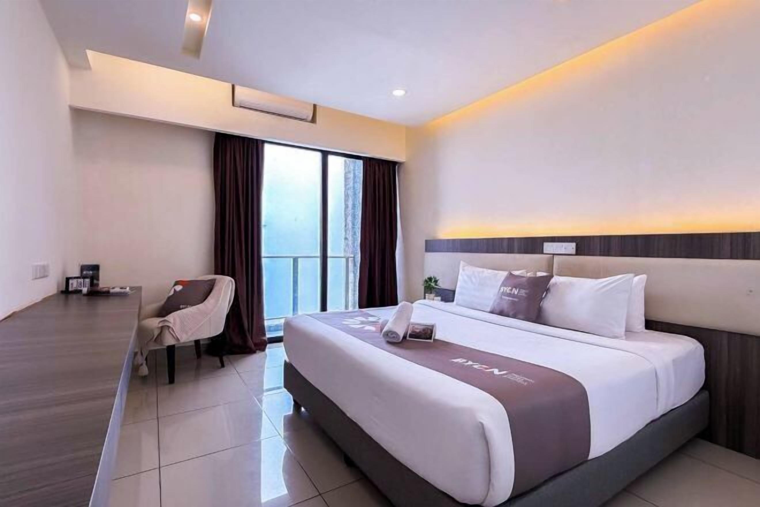 Desk, blackout drapes, iron/ironing board, bed sheets