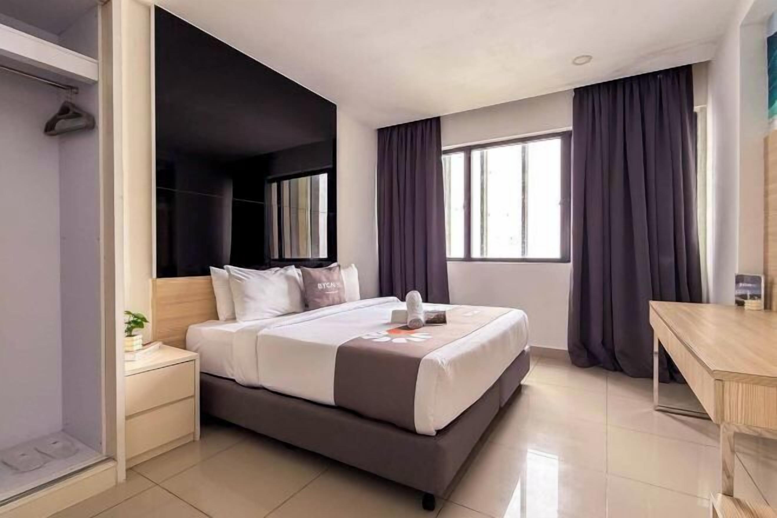 Desk, blackout drapes, iron/ironing board, bed sheets