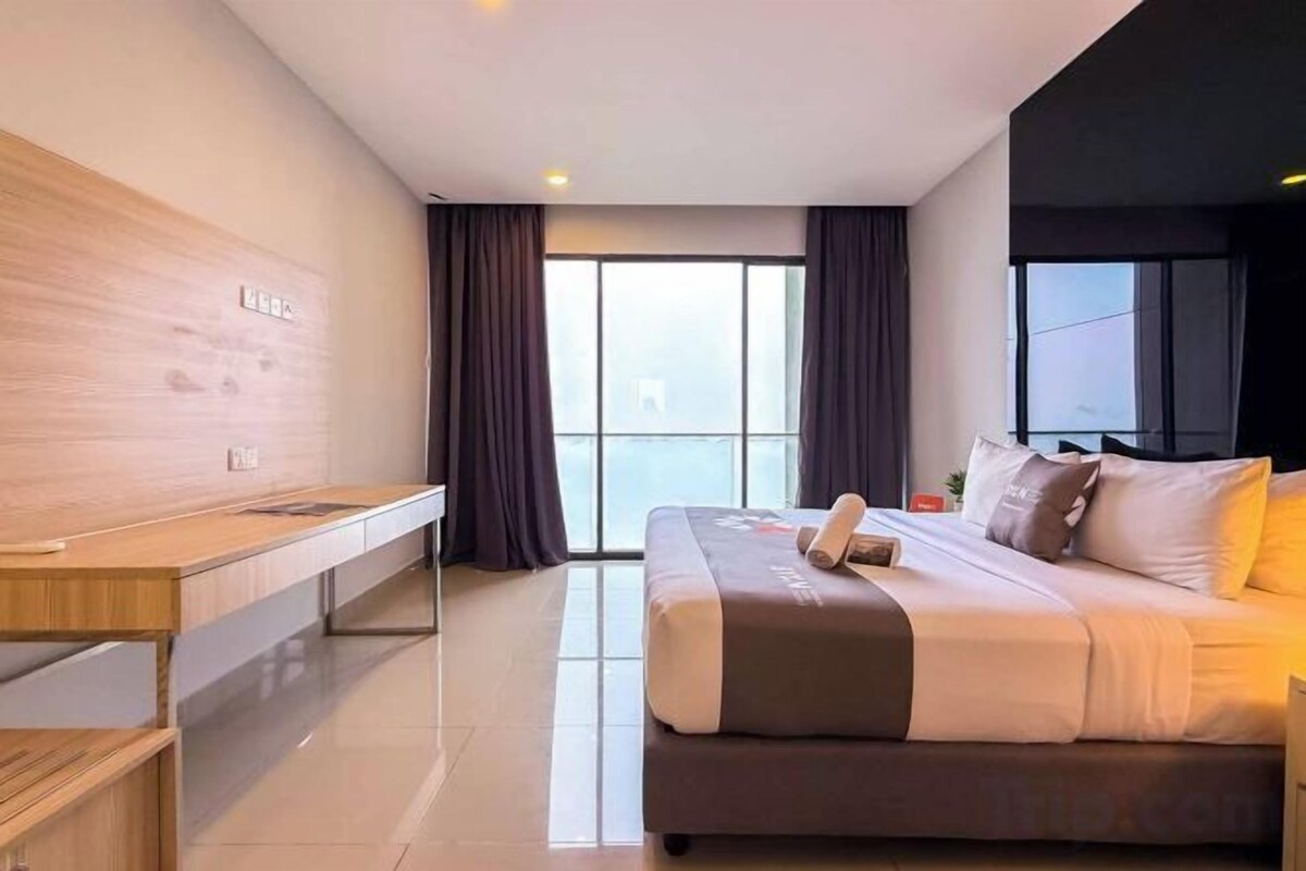 Desk, blackout drapes, iron/ironing board, bed sheets