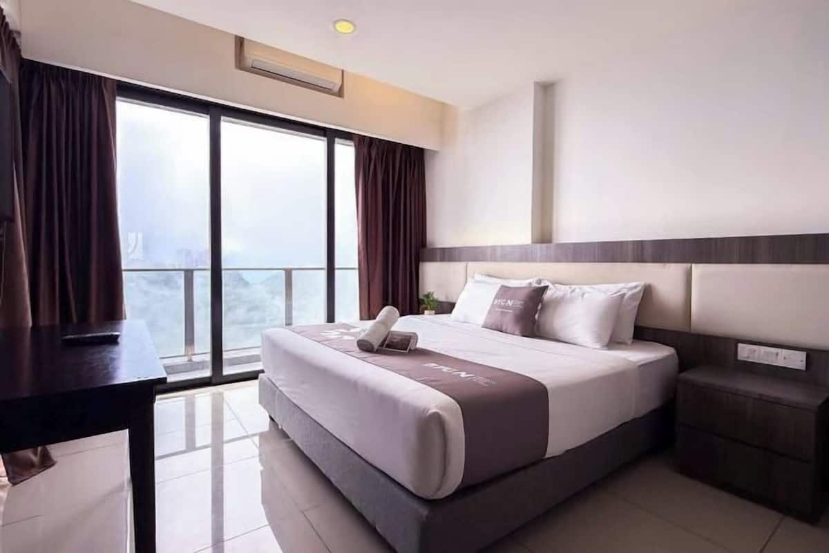 Desk, blackout drapes, iron/ironing board, bed sheets