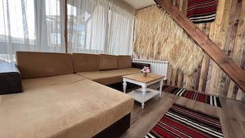 Room, 2 Bedrooms, Smoking, Balcony | Living area | Flat-screen TV