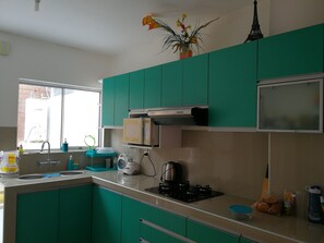 Fridge, microwave, stovetop, coffee/tea maker